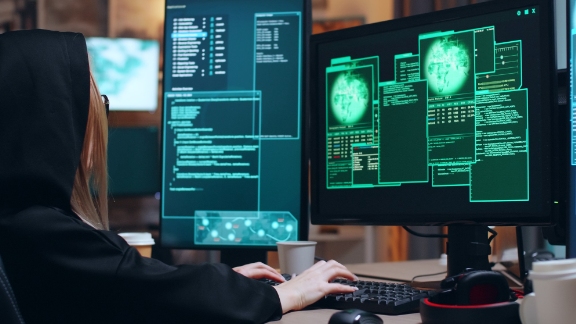 female coder working on a computer